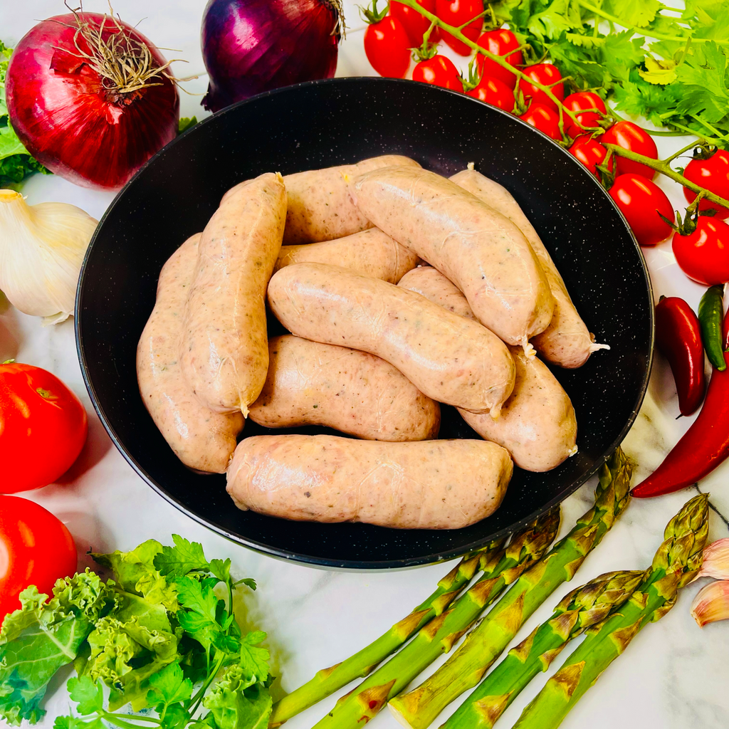 Pork sausages in a frying pan
