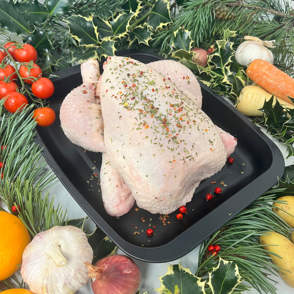 Whole Chicken Dressed in French Deco in a baking tray