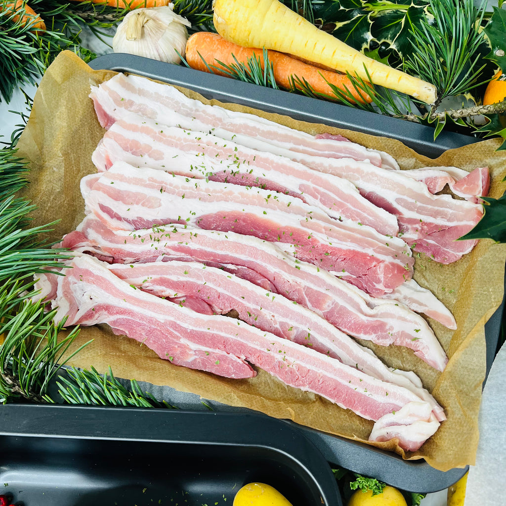 Streaky bacon with spices in a baking tray